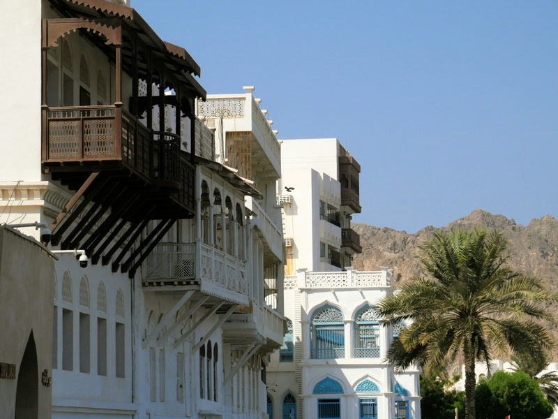 Traditional houses with carved balconies on Muttrah Corniche, Muscat